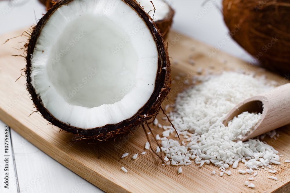 Whole and broken coconut with grated cocont flakes. Whole and broken coconut with grated cocont flakes.