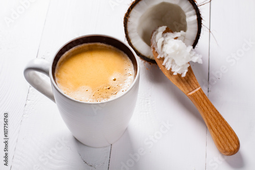 Bulletproof coffee, it's a coffee blended with butter or coconut oil. Wiev from above on coffee and coconut. Part of ketogenic diet, better choice before trainning.