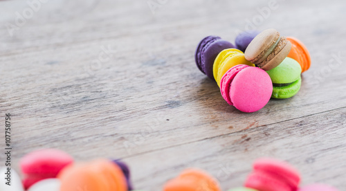 french sweet delicacy, colourful macaroons variety with wood Bac