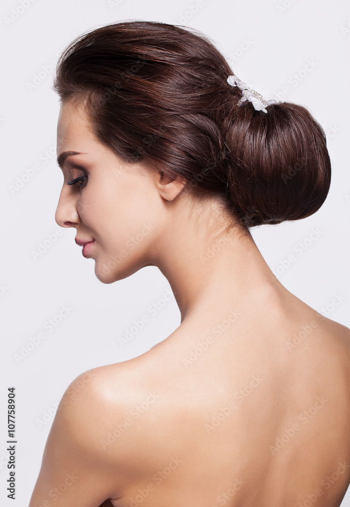 Portrait of beautiful young brunette woman from back side Portrait of beautiful young brunette woman from back side