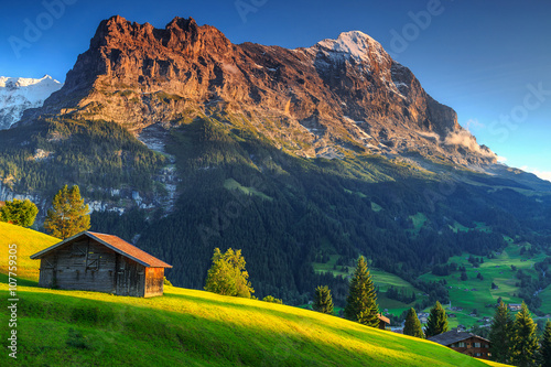 фотографія Typical wooden alpine chalets,Eiger North face,Grindelwald,Switzerland,Europe