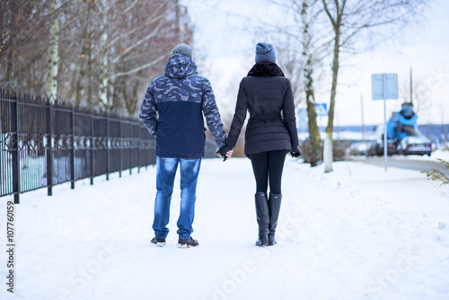 Beautiful adult couple love  park in winter