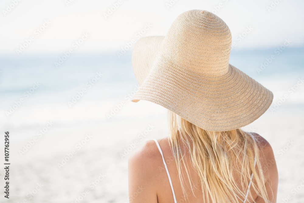Blonde woman posing on the beach