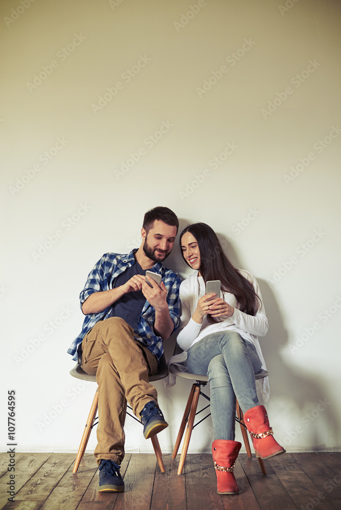 Man showing the woman something on the smartphone Man showing the woman something on the smartphone