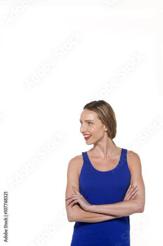 Young sporty Caucasian woman with arms crossed