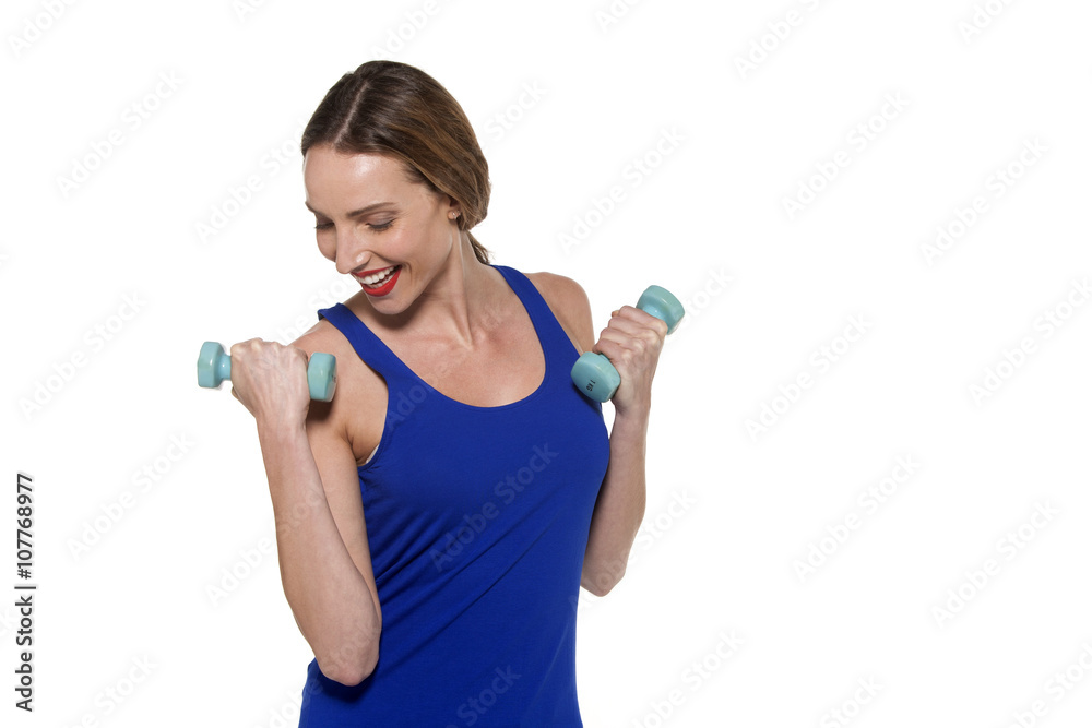 Young sporty Caucasian woman using weights Young sporty Caucasian woman using weights