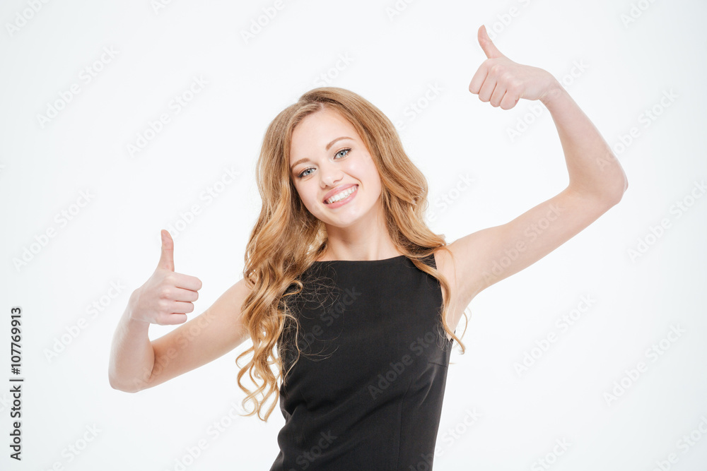 Smiling young woman showing thumbs up Smiling young woman showing thumbs up