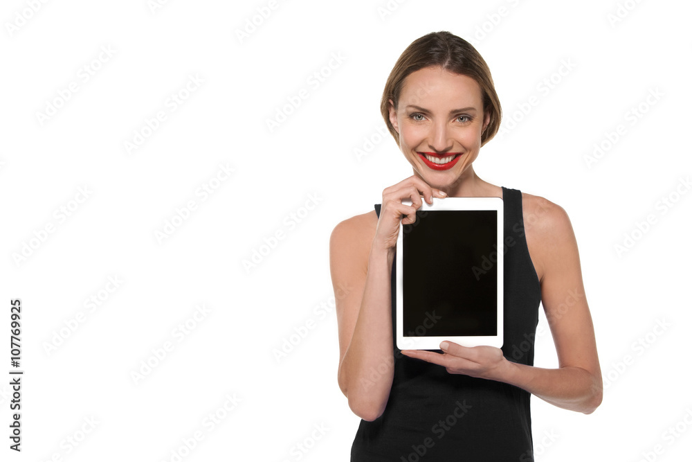 Young Caucasian woman showing a tablet with blank screen Young Caucasian woman showing a tablet with blank screen