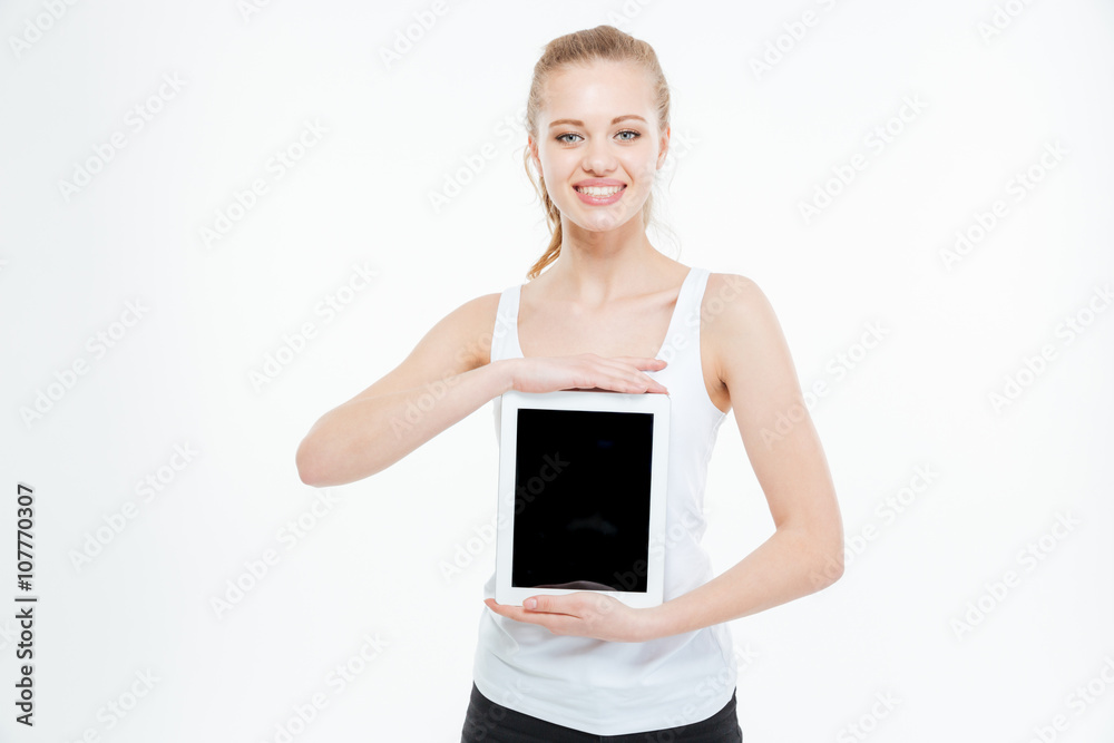 Smiling casual woman showing blank tablet computer screen Smiling casual woman showing blank tablet computer screen