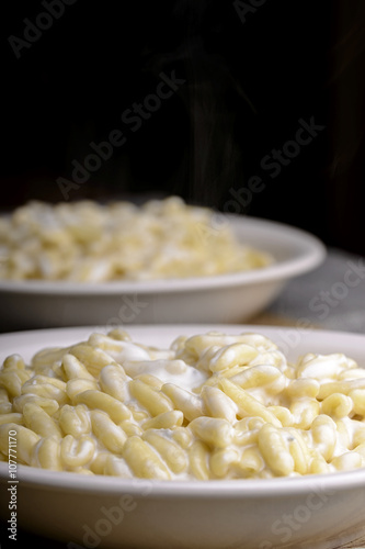 two plates of gnocchi gorgonzola and cream