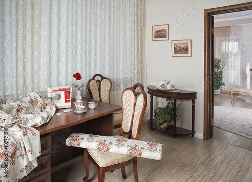 workplace оf seamstress or designer with sewing machine and lux