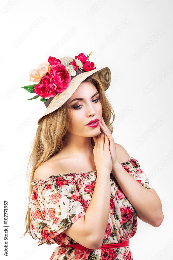beautiful young woman (girl) in wreath and hat with flowers on a white background.