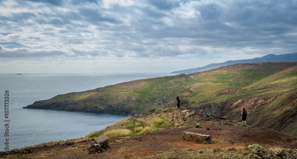 Tourists looking at the landscape of Madeira east coast. Tourists looking at the landscape of Madeira east coast.