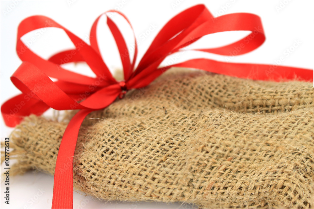 Jute sack present with red ribbon Jute sack present with red ribbon