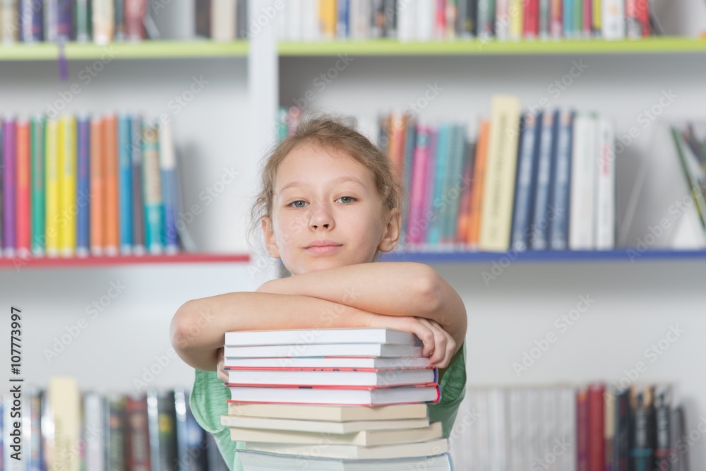 Cute girl reading book in library
Cute girl reading book in library