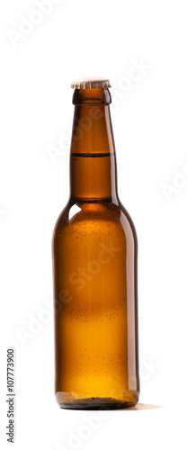Photo of an small Bottle of beer white background isolated . Studio shot indoors No lebel