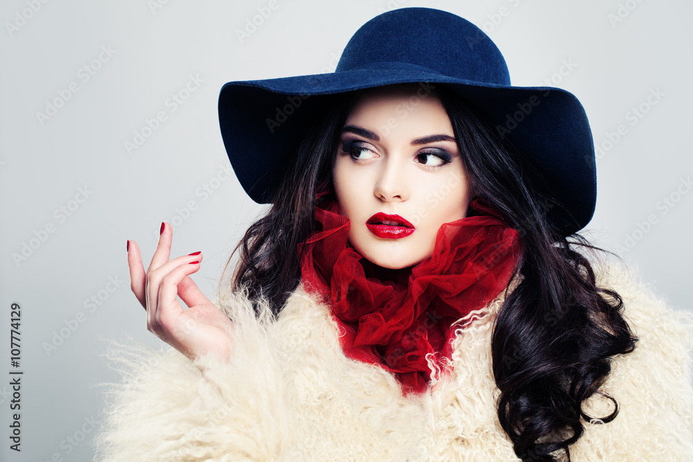 Fashion Model Woman in Blue Hat Looking at Her Hand Fashion Model Woman in Blue Hat Looking at Her Hand