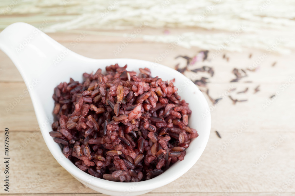 Cooked rice berry with jusmine rice on wood table Cooked rice berry with jusmine rice on wood table