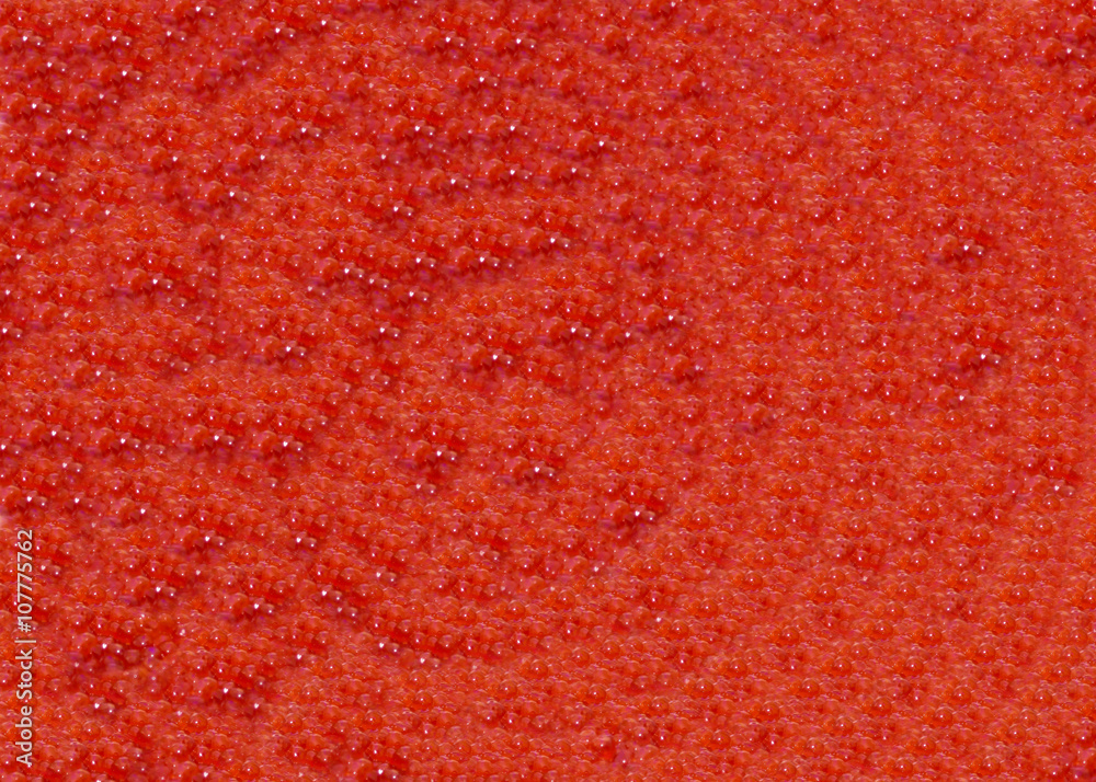 Background from fresh red sea salmon caviar. Texture of the eggs. Raw salted salmon caviar. The fish delicacy for gourmets. Background from fresh red sea salmon caviar. Texture of the eggs. Raw salted salmon caviar. The fish delicacy for gourmets.