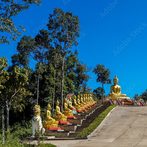 Buddhas at the stairs to Wat Hua Lang Northern Thailand photo