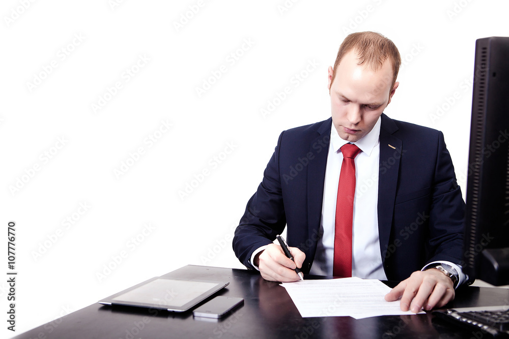 Businessman signs a contract in the workplace. Businessman signs a contract in the workplace.