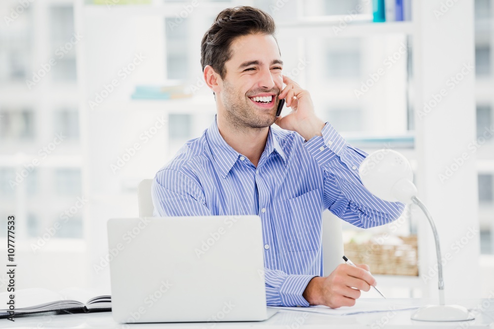 Fototapeta premium Businessman talking on mobile phone