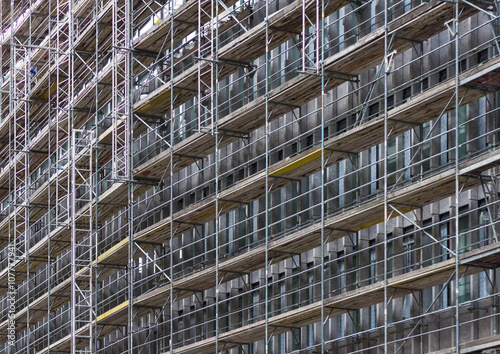 building facade with scaffolding, construction site