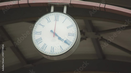 Close up shot of the public clock in a railway station