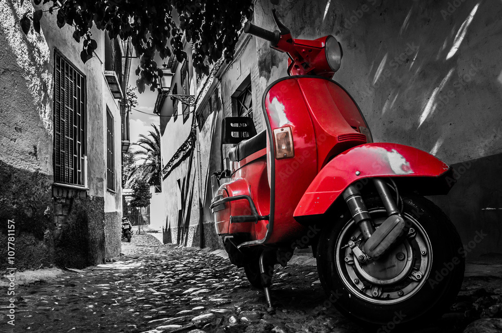 Valokuva A red vespa scooter parked on a paved street - tilaa netistä  Europosters.fi