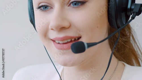 Portrait of young female customer service executive with headset 