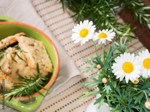 Spring home baking concept with cookies and daisies