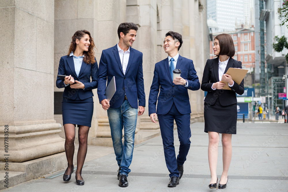 Group of business team walking at street Group of business team walking at street