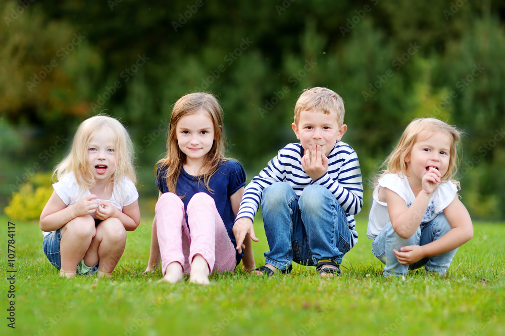 Four adorable little kids outdoors