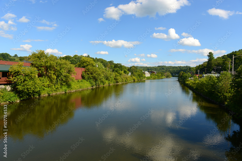 Winooski River cross the center of Montpelier in summer, Montpelier, Vermont, USA. Montpelier is the capital of Vermont and is the smallest capital city in the United States. Winooski River cross the center of Montpelier in summer, Montpelier, Vermont, USA. Montpelier is the capital of Vermont and is the smallest capital city in the United States.
