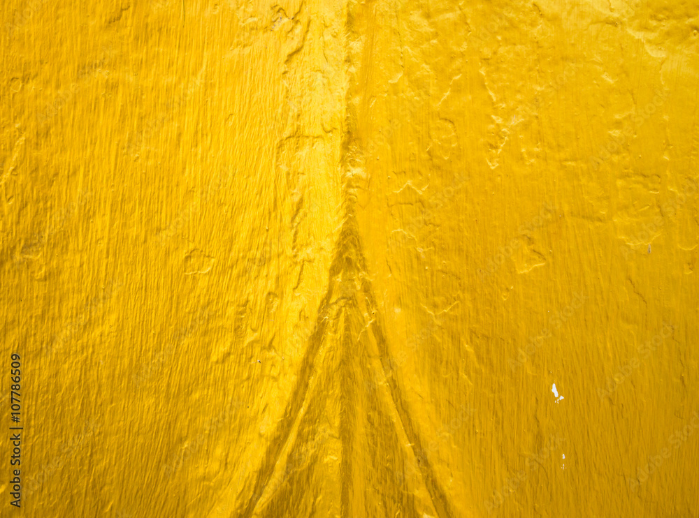 Naklejka premium Golden Stone wall for texture background