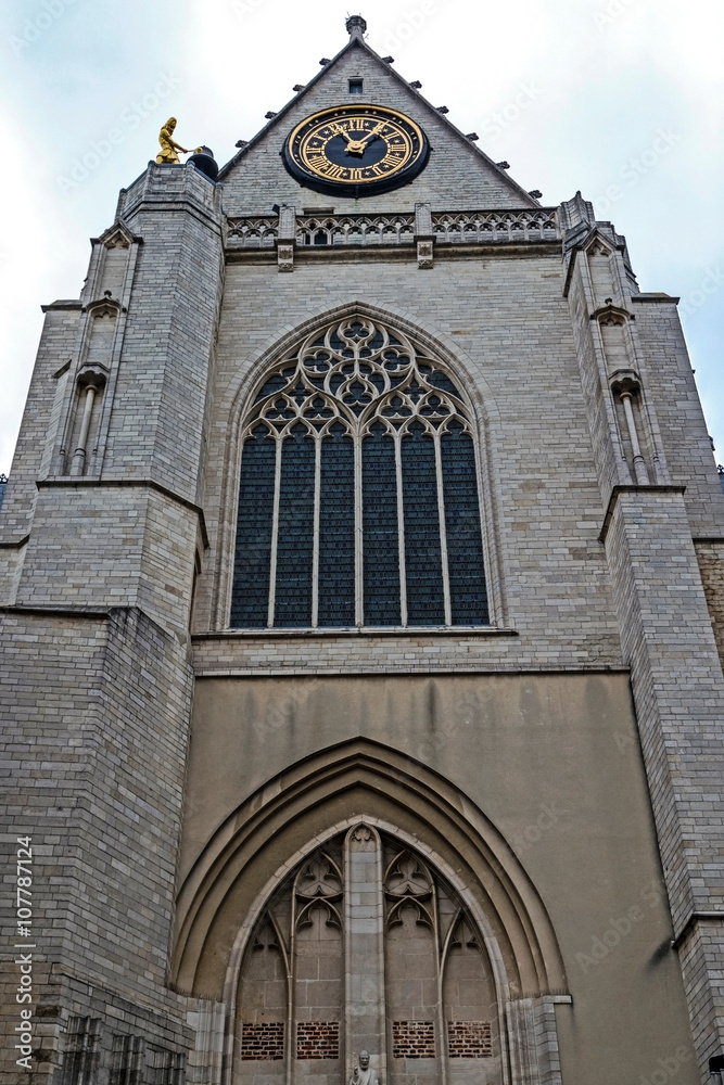 Facade and clock of the medieval Saint Peters church in Leuven,