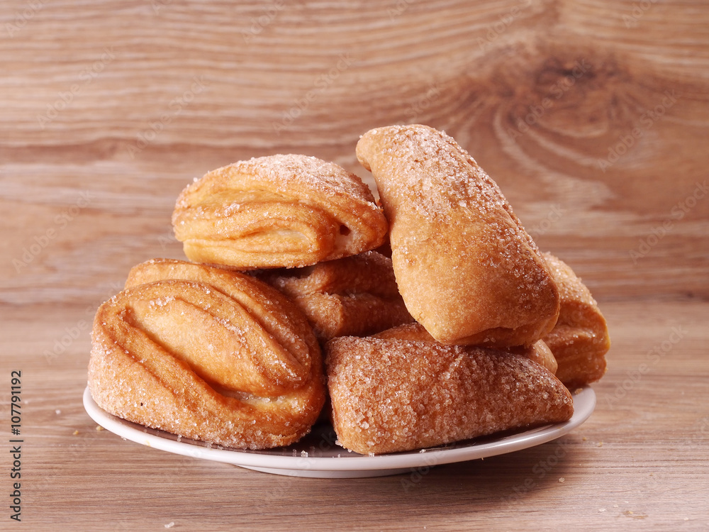 Flaky biscuits with sugar on a plate