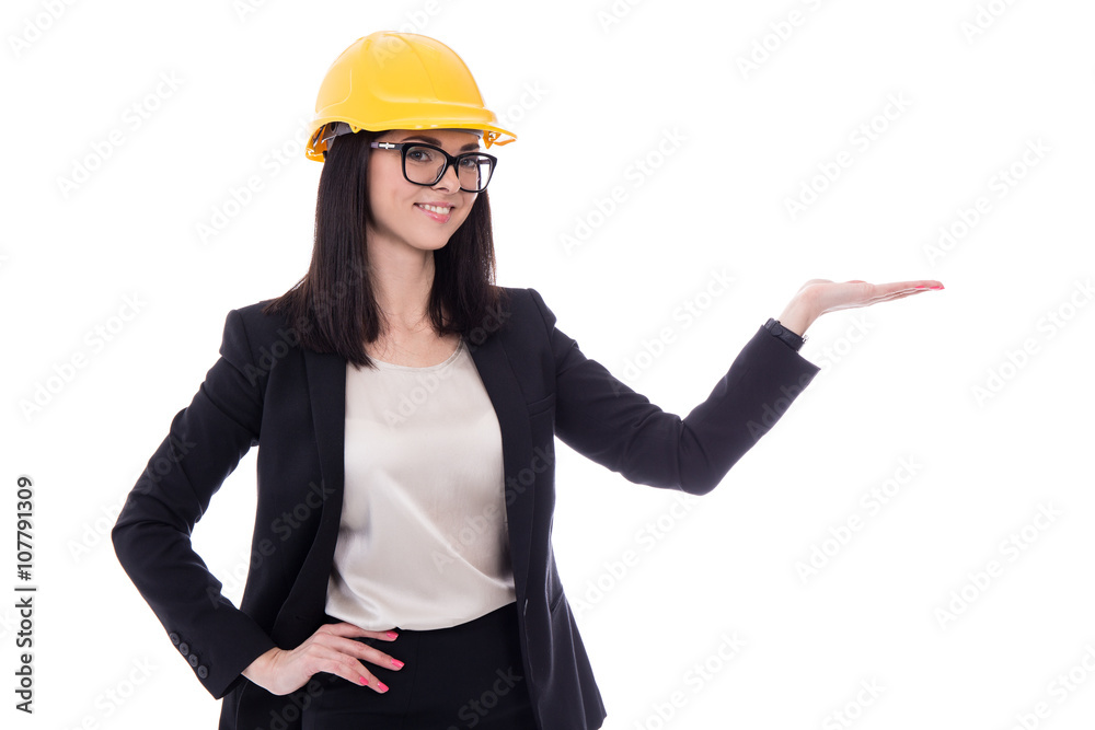 business woman architect in yellow helmet holding or presenting business woman architect in yellow helmet holding or presenting