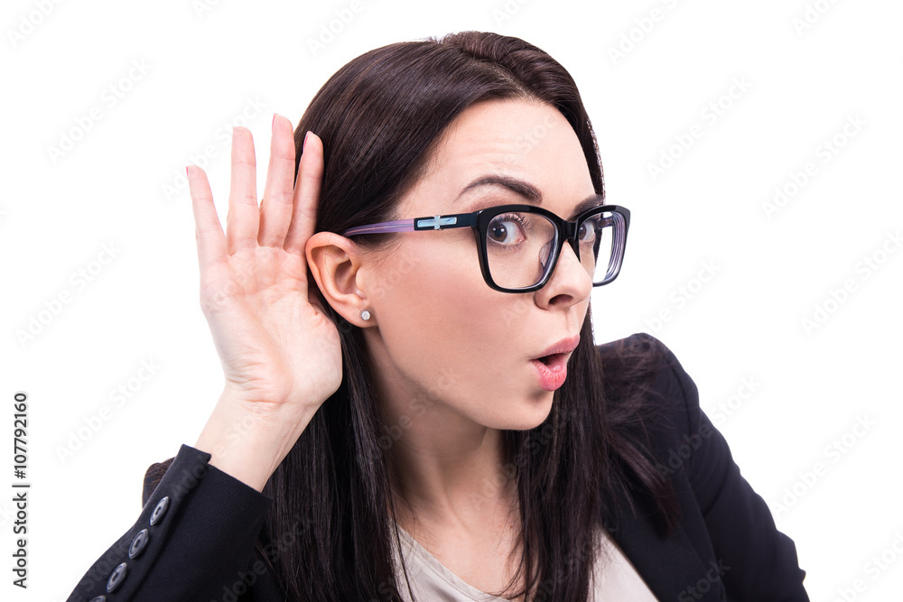 gossip concept - young business woman overhears a conversation i gossip concept - young business woman overhears a conversation i