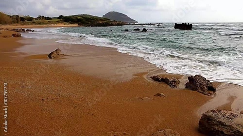 seascaoe with foamy swashing waves and cloudy sky photo