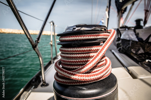 Winch with red and white rope on sailing boat in the sea © wavemovies