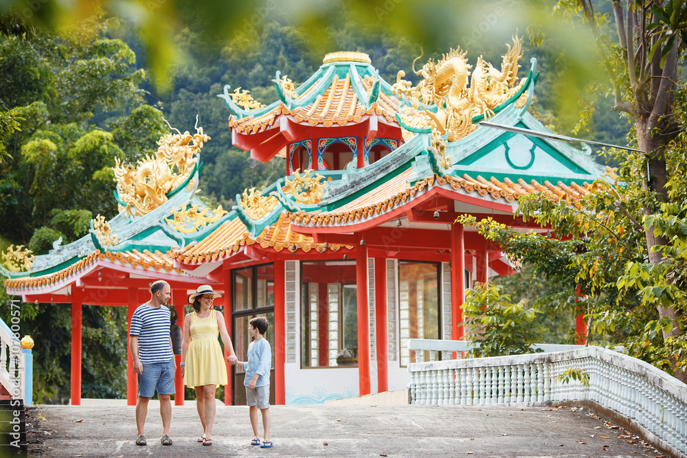Naklejka premium Family enjoying views of beautiful Chinese Temple on Koh Phangan island