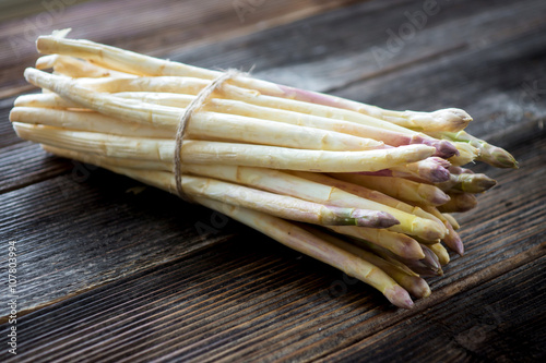 white asparagus on wooden background
