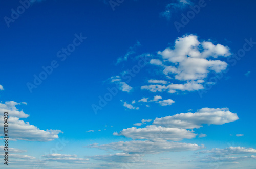 white fluffy clouds in the blue sky © ZaZa studio