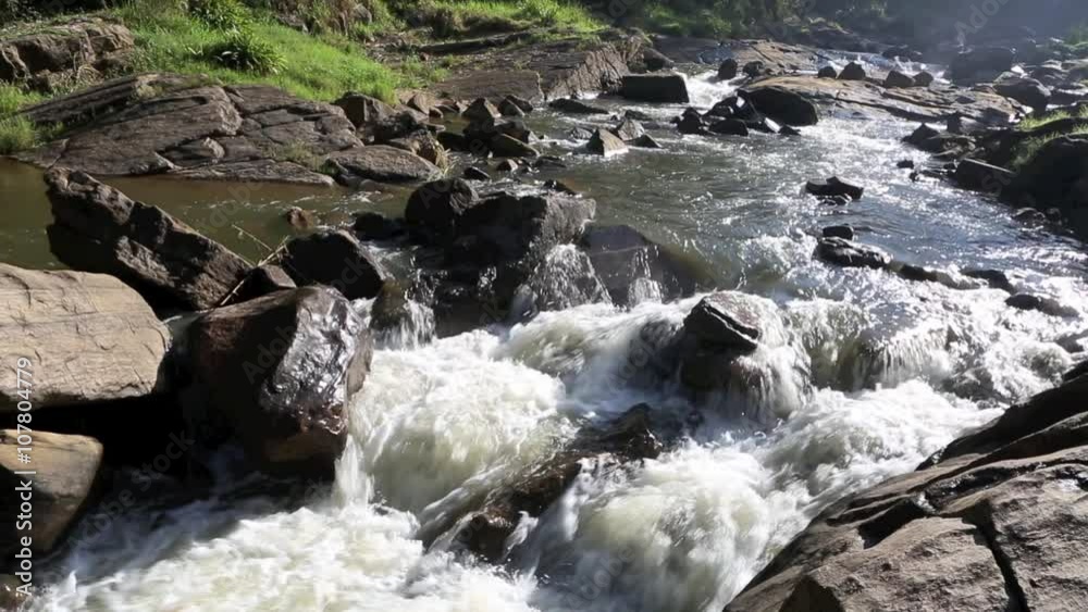 Whitewater flowing over rocks in small river at Maskeliya, Sri Lanka Whitewater flowing over rocks in small river at Maskeliya, Sri Lanka