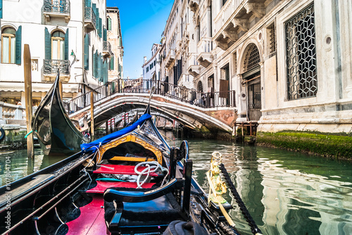 Gondola trip, Venice. / Gondolas are one of main attraction in lovely Venice. Road with gondola is unique experience and great touristic attraction in Venice, Italy.