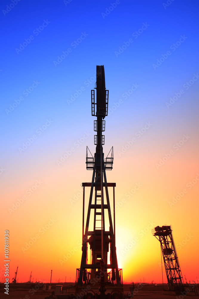 In the evening, the silhouette of the oil pump In the evening, the silhouette of the oil pump