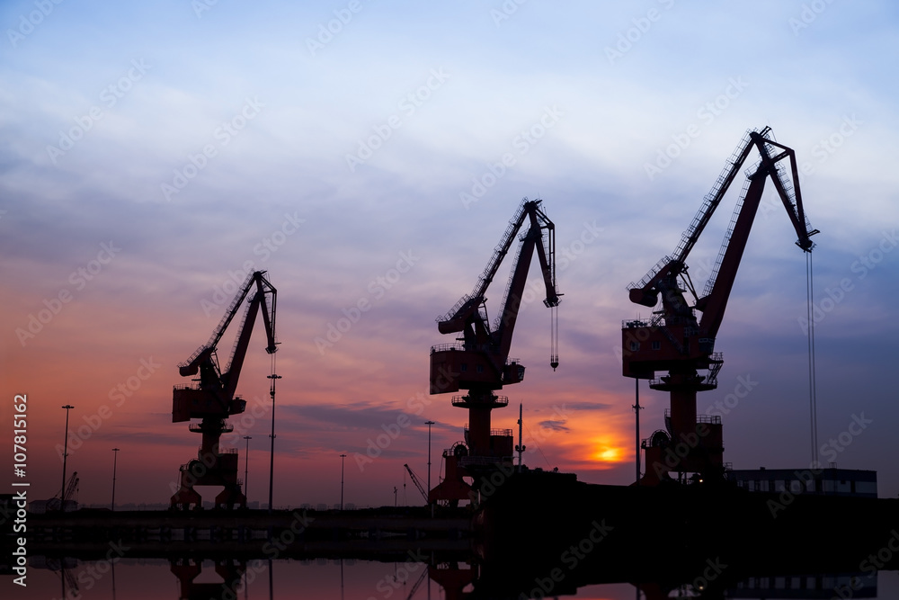 In the evening, portal crane in freight terminal In the evening, portal crane in freight terminal