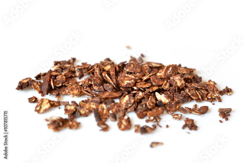 Chocolate granola with almond and cocoa nib on white background