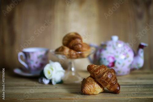 cup croissant breakfast wooden background